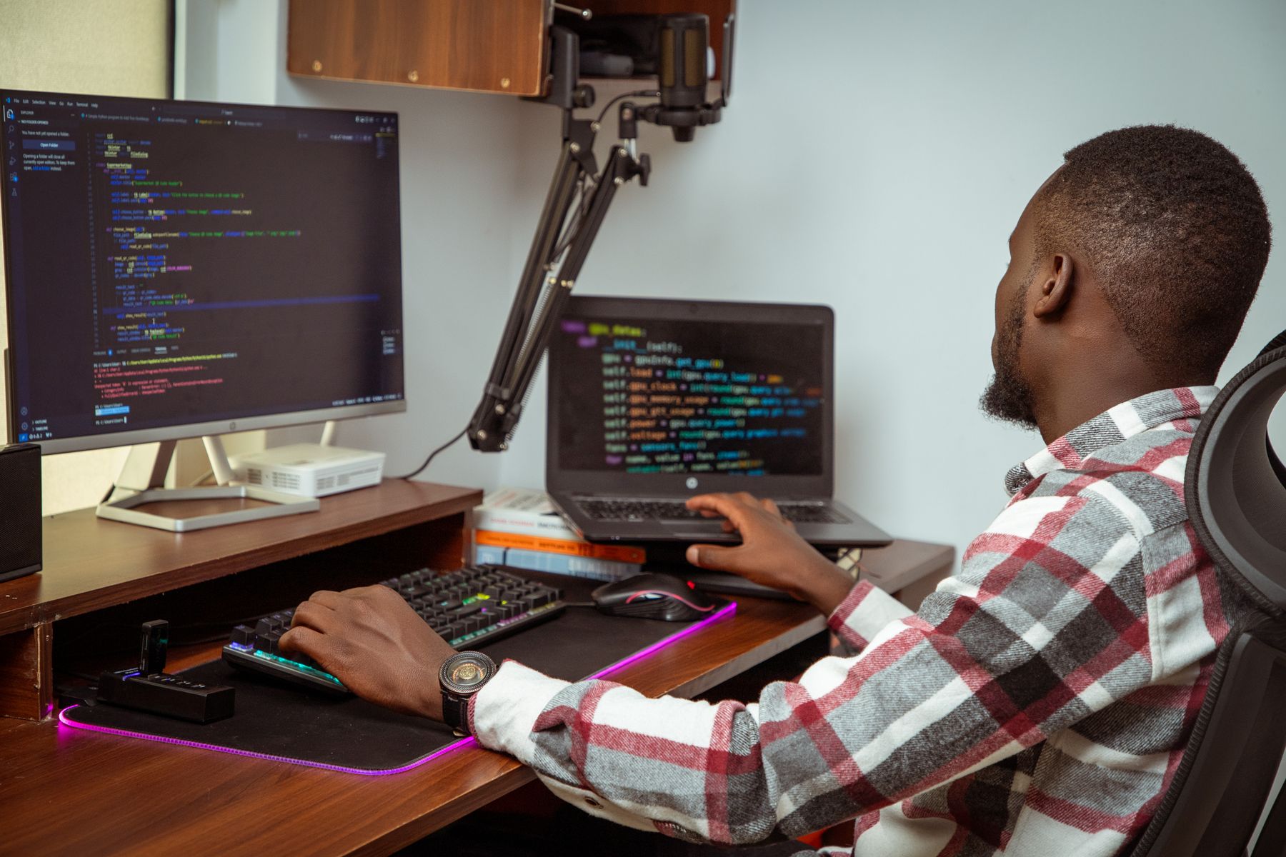 A developer writing code at his desk